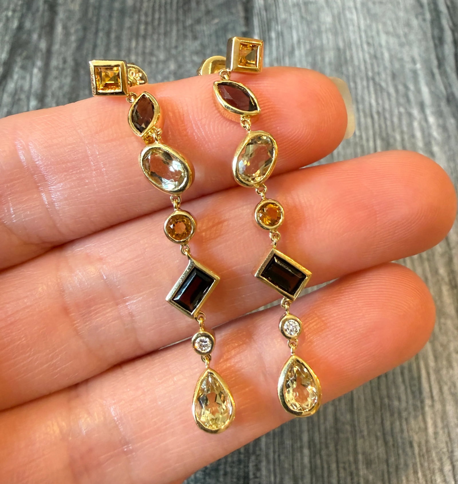 Multi Shape Citrine, Smoky Topaz, and Diamond Dangle Earrings in 18K Gold (I): Metal: 18K Yellow Gold Weight: 5.9 gramsMeasurements: 2 inches long Markings: "750"Condition: In very good condition with some minor surface wear.Follow us on Instagram @alphaomegajewelry for the late
