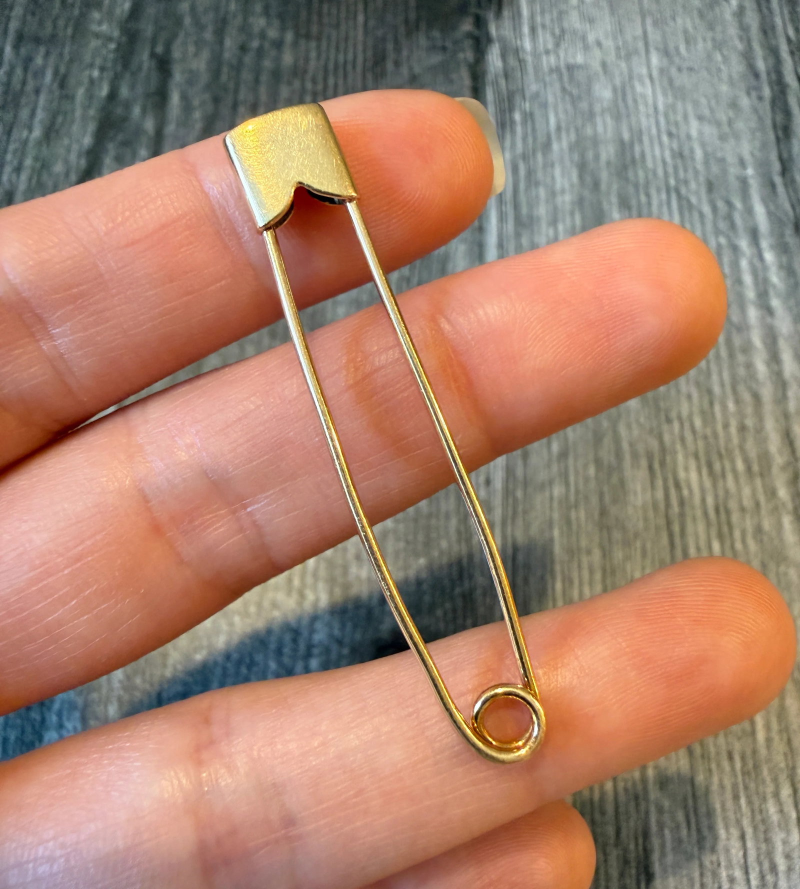 Long Vintage 14K Gold Safety Pin: Metal: 14K Yellow Gold Weight: 2.3 gramsMeasurements: 0.3 inches long by 2.1 inches wideMarkings: "14K"Condition: In very good condition with some minor surface wear.Follow us on Instagram @alphaomega