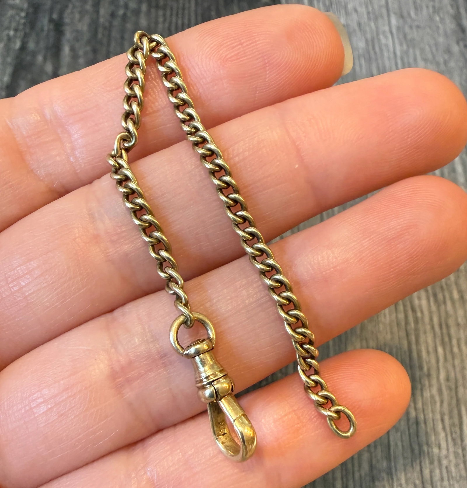 Antique 14K Gold Curb Link Chain Extender with Dog Clip, 4.9?? Long: Metal: 14K Yellow Gold Weight: 4.6 gramsMeasurements: 4.9 inches long by 2.9 mm wideMarkings: "14K"Condition: In very good condition with some minor surface wear. A jump ring can be added at the end f