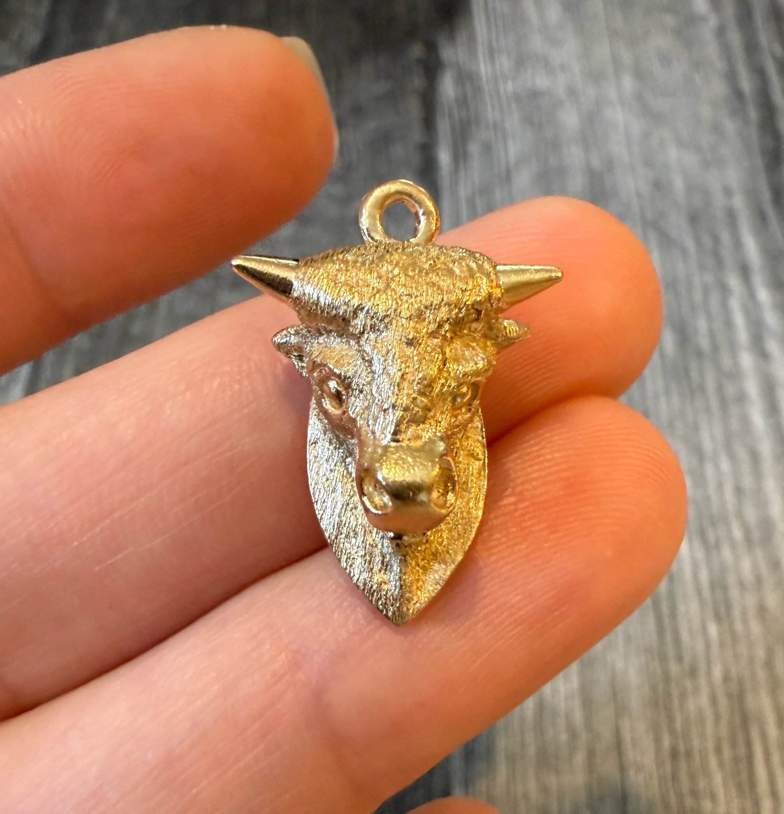 Dankner Bull’s Head Charm in 14K Gold: Metal: 14K Yellow Gold Weight: 6.4 gramsMeasurements: 0.7 inches long by 0.7 inches wideMarkings: "D 14K"Condition: In very good condition with some minor surface wear. A bale can be added if requeste