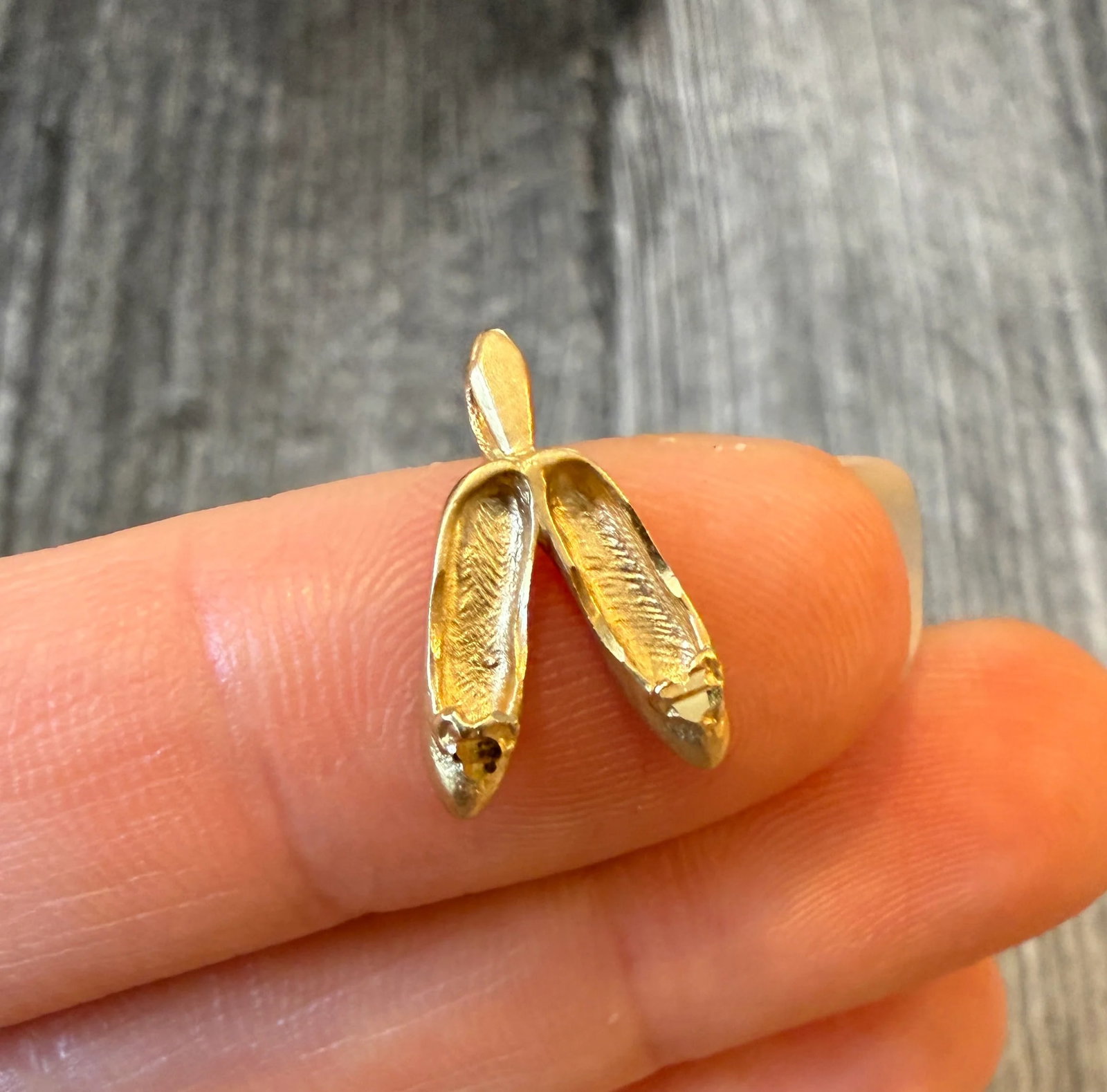 Ballerina Shoes Charm in 14K Gold: Metal: 14K Yellow Gold Weight: 0.8 gramsMeasurements: 0.45 inches long by 0.45 inches wide Markings: "14K"Condition: In good condition with some minor surface wear.Follow us on Instagram