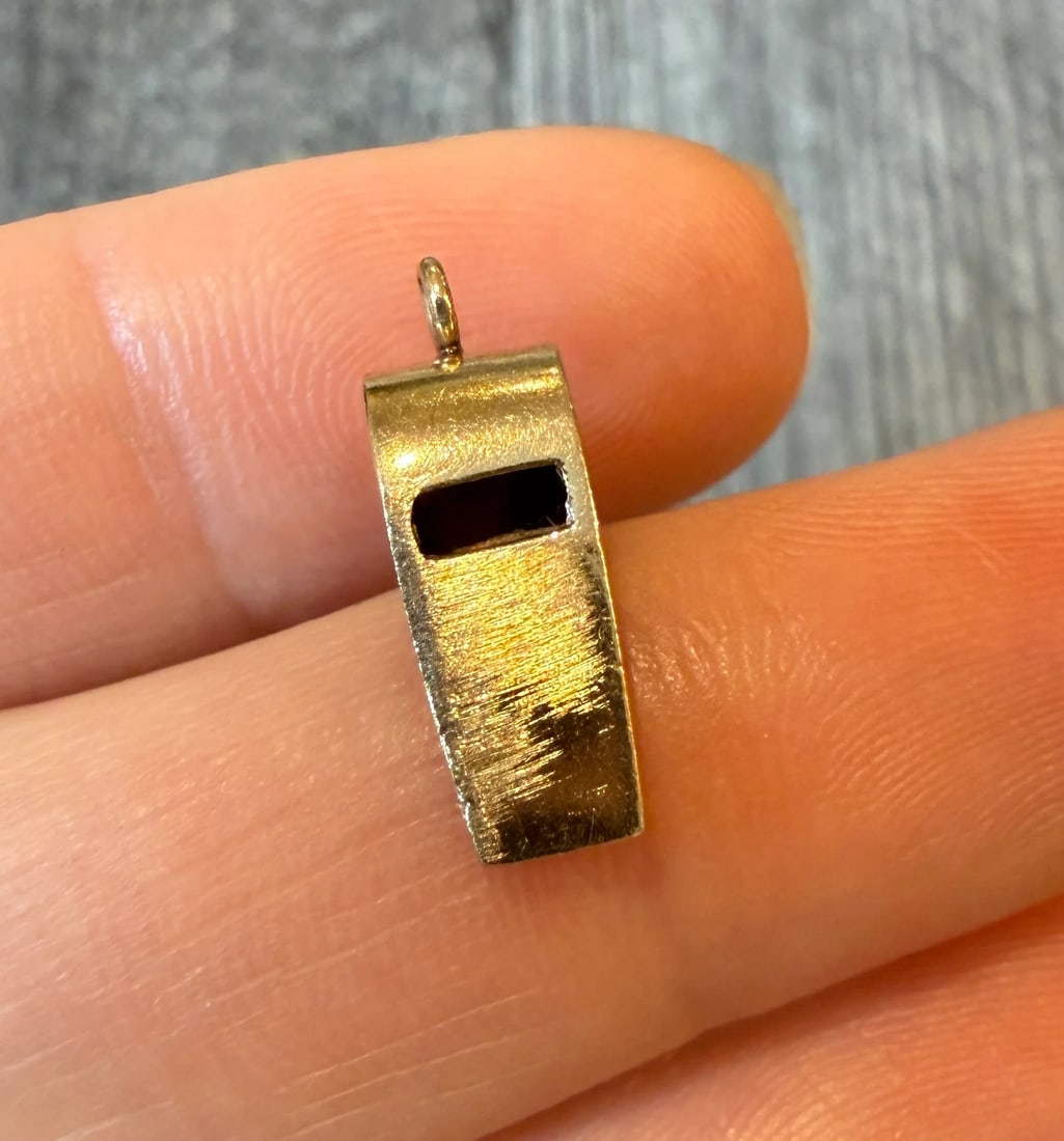 Wider Vintage Whistle Charm in 14K Gold: Metal: 14K Yellow Gold Weight: 1.6 gramsMeasurements: 0.65 inches long by 0.25 inches wideMarkings: "14K"Condition: In fair condition with a light file mark and some surface wear.Follow us on Instagra