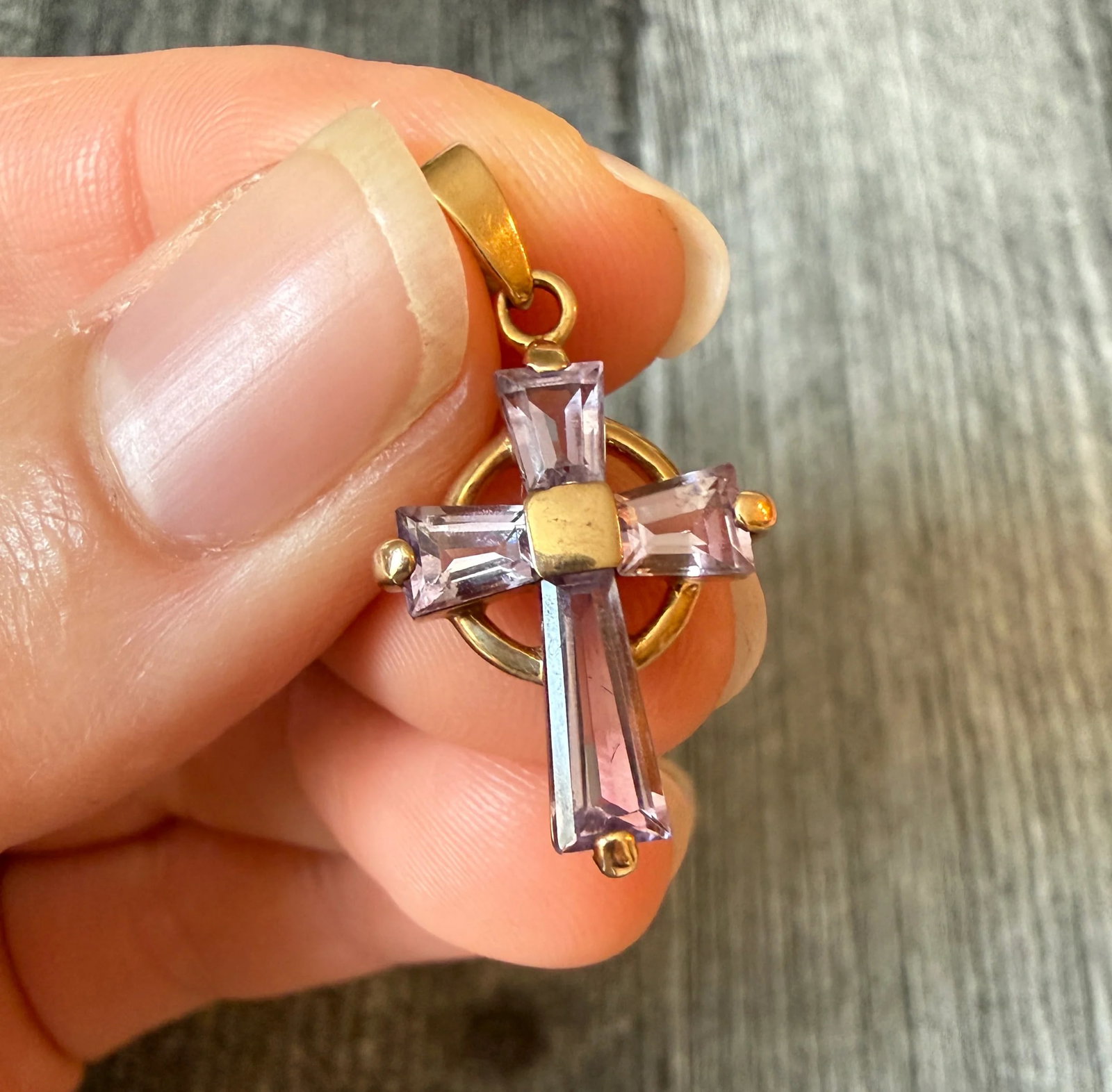 Lilac Amethyst Cross Charm in 14K Gold: Metal: 14K Yellow Gold Weight: 2.5 gramsMeasurements: 0.75 inches long by 0.55 inches wideMarkings: “585”Condition: In very good condition with some minor surface wear Follow us on Instagram @