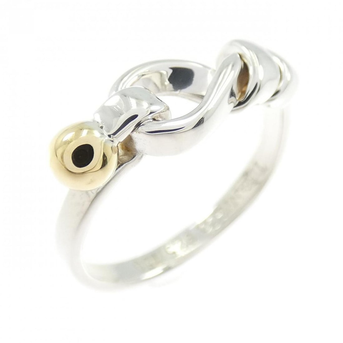 Tiffany & Co. Flat Wire Love Knot Ring: --- Catalog ---Category: SizeJP Size: 10US Size: 5.5Category: DesignType: Band ringColor: Silver, Yellow goldGender: WomenMaterial: Silver 925, Yellow gold (18K)Category: GeneralBrand: Tiffany---
