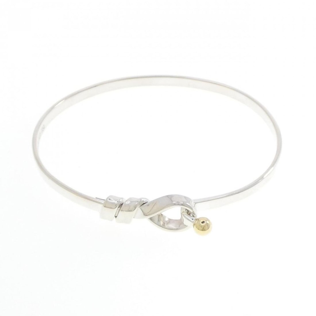 Tiffany Hook & Eye Bangle: --- Catalog ---Category: SizeLength: 16.5cm / 6.49''Category: DesignType: BangleColor: Silver, Yellow goldGender: WomenMaterial: Silver 925, Yellow gold (18K)Category: GeneralBrand: Tiffany--- Item Li