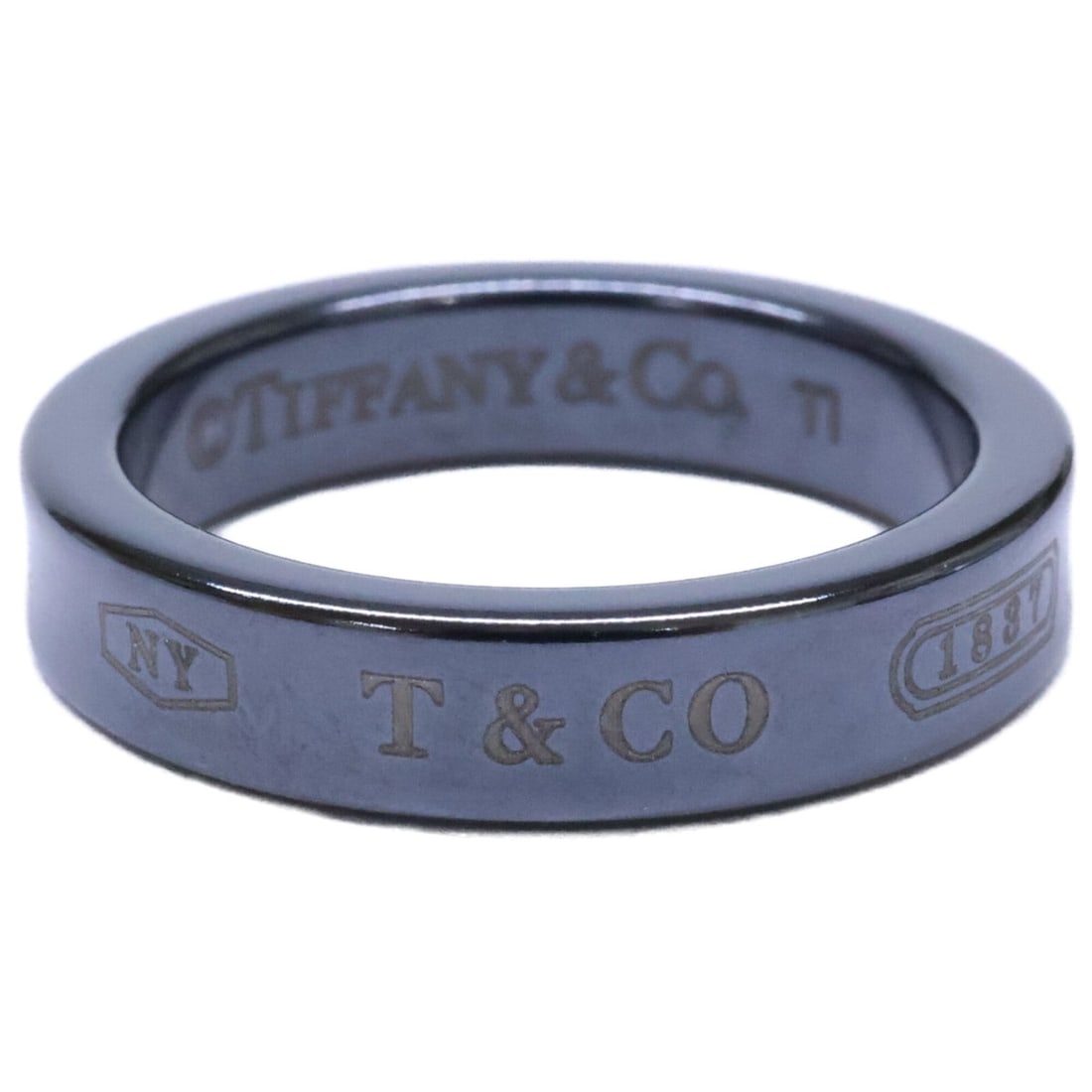 TIFFANY&Co. Tiffany 1837 Black Titanium Narrow Ring (Women's): --- Catalog ---Category: SizeJP Size: 9US Size: 5Category: DesignType: Band ringColor: BlackGender: WomenMaterial: TitaniumCategory: GeneralBrand: Tiffany--- Item List ---Section: ConditionRanking: Ra
