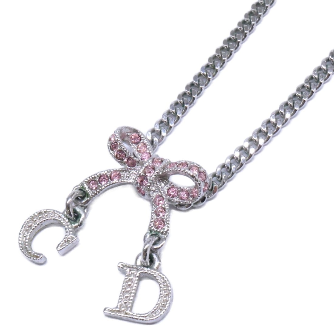 Christian Dior Rhinestone Ribbon Pendant Chain Necklace, Silver, Pink, Women's: --- Catalog ---Category: SizePendant Size: 13mm x 18mm / 0.51'' x 0.7''Neck Circumference: 41.5 cm / 16.33''Category: DesignColor: Pink, SilverGender: WomenMaterial: MetalNecklace Type: NecklaceCatego