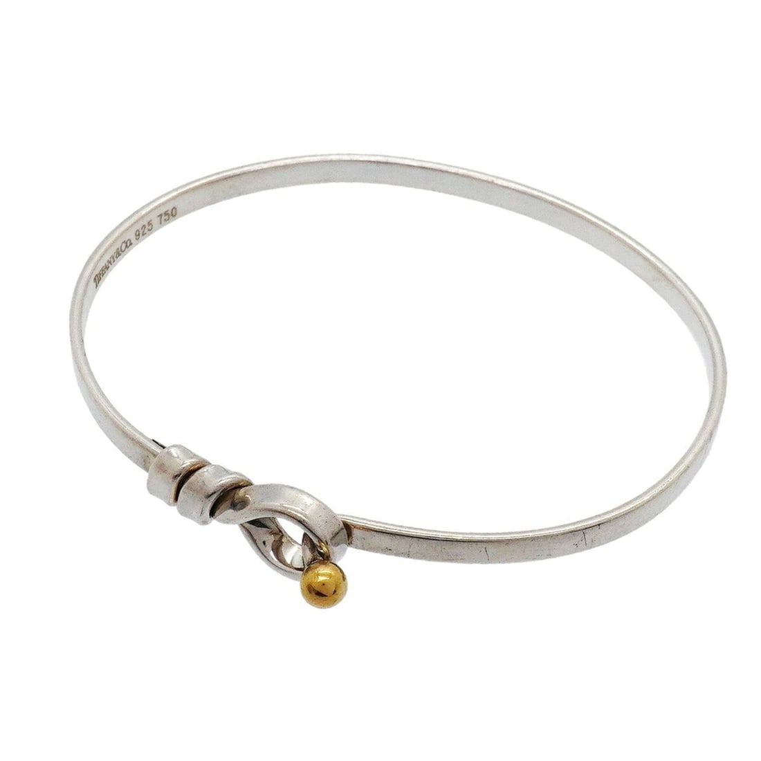 Tiffany & Co. Hook Eye Bangle, 18K Yellow Gold (KYG), Sterling Silver 925, Women's: --- Catalog ---Category: SizeLength: 16.5cm / 6.49''Category: DesignType: BangleGender: WomenMaterial: Silver 925, Yellow gold (18K)Category: GeneralBrand: Tiffany--- Item List ---Section: ConditionRa