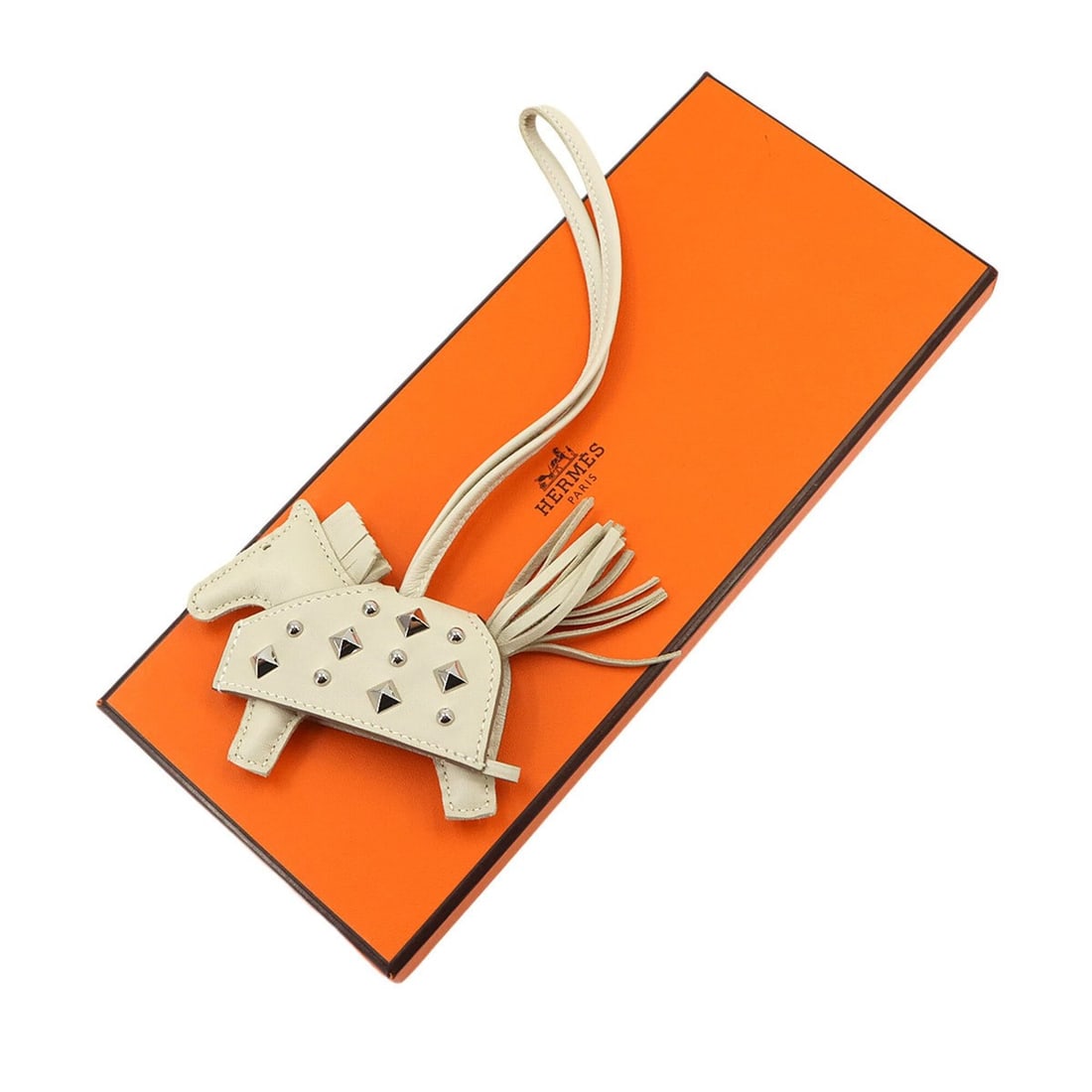 Hermes Rodeo Robeo Rock PM Accessory Bag Charm, Agneau Milo Craie, K Stamp, Silver Hardware: --- Catalog ---Category: SizeWeight: 23.8g / 0.83oz.Chain Length: 170.00mm / 6.69''Size (HxWxD): 75.00mm x 125.00mm / 2.95'' x 4.92''Category: DesignType: Handbag charmGender: WomenMaterial: Agneau Mi