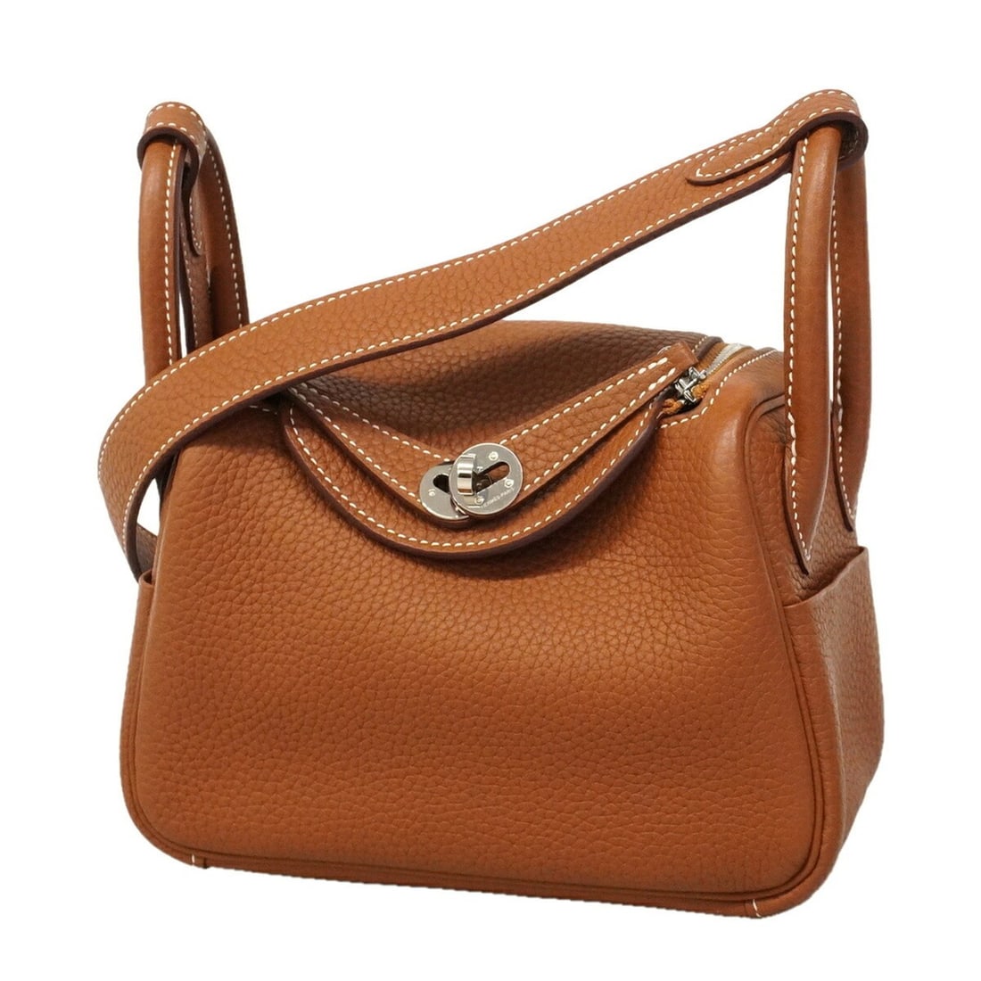 Hermes Lindy Mini handbag, Taurillon Clemence leather, gold, K stamp, 2-way bag for women.: --- Catalog ---Category: SizeSize (HxWxD): 12cm x 18cm x 9cm / 4.72'' x 7.08'' x 3.54''Category: DesignType: HandbagColor: GoldGender: WomenMaterial: Taurillon clemence leather Hardware Color: SilverC