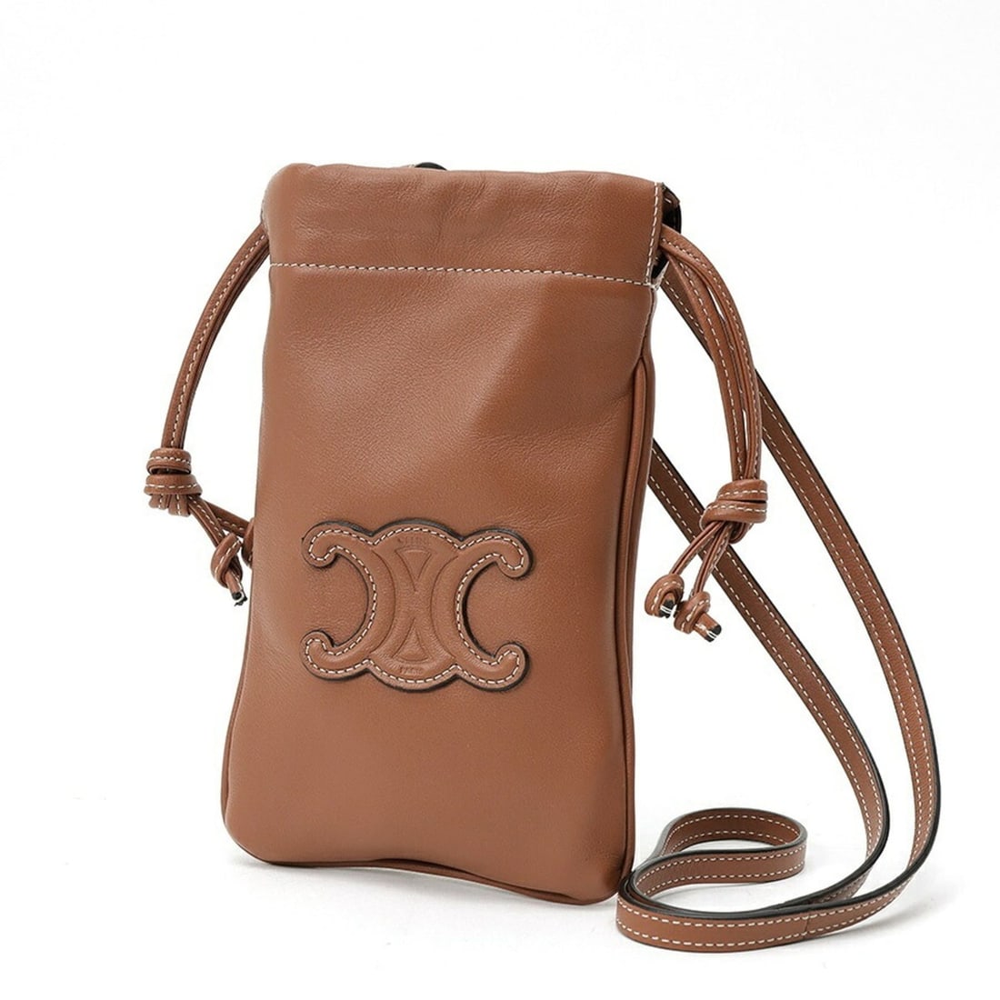 Celine Cuile Triomphe Mobile Phone Pouch Smartphone Holder 10L16 Leather Tan (Brown): --- Catalog ---Category: SizeSize (HxWxD): 20cm x 12.5cm x 5.00mm / 7.87'' x 4.92'' x 0.19''Category: DesignType: PouchColor: BrownGender: WomenMaterial: Leather Category: GeneralBrand: CelineCountry 