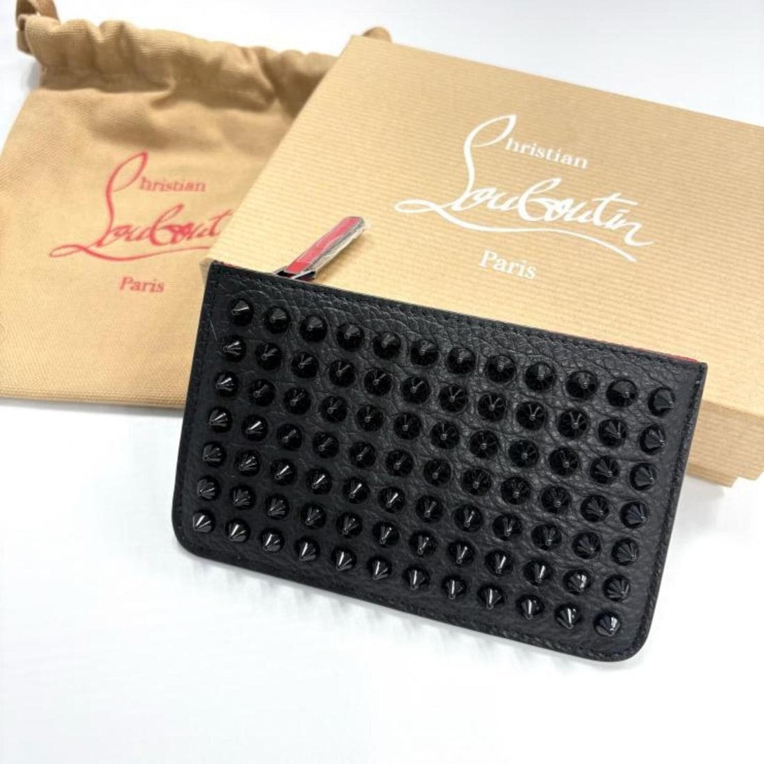 Christian Louboutin Panettone Studded Wallet/Coin Case, Leather, Black/Red: --- Catalog ---Category: SizeSize (HxWxD): 8cm x 13cm x 1cm / 3.14'' x 5.11'' x 0.39''Category: DesignType: Coin purse/coin caseColor: Black, Red colorGender: Men,WomenMaterial: Leather Category: Gene