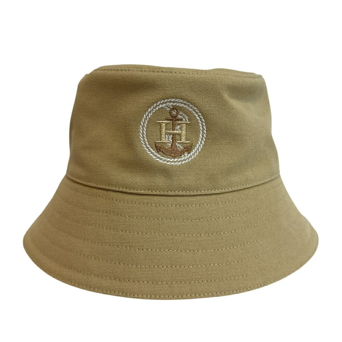HERMES Milo H Ankle Bucket Hat, Beige: --- Catalog ---Category: DesignType: Bucket hatColor: BeigeGender: Unisex,Women,MenMaterial: Cotton Category: GeneralBrand: HermesCategory: MeasurementsHeight: 15.5cm / 6.1''Circumference: 58cm /