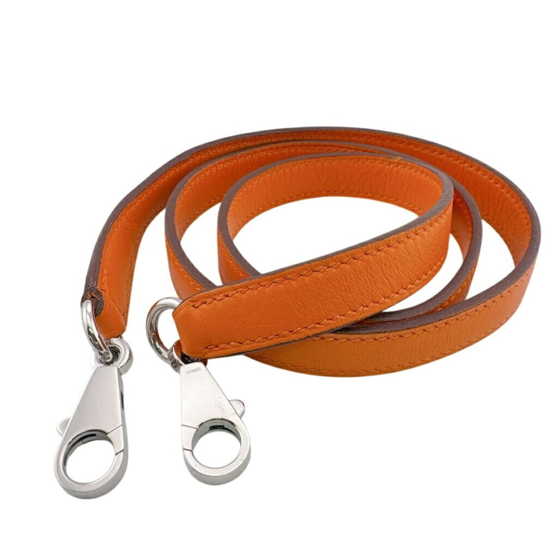 HERMES Hermes Shoulder Strap Orange: --- Catalog ---Category: SizeSize (HxWxD): 1.5cm x 88cm / 0.59'' x 34.64''Category: DesignType: StrapColor: OrangeGender: WomenMaterial: LeatherCategory: GeneralBrand: Hermes--- Item List ---Section: