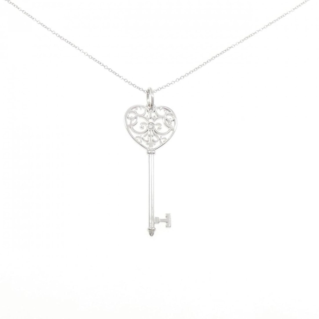 Tiffany & Co. Enchanted Heart Key Necklace: --- Catalog ---Category: SizePendant Size: 46.1mm x 16.1mm / 1.81'' x 0.63''Neck Circumference: 45 cm / 17.71''Category: DesignGender: WomenMaterial: White gold (18K)Pendant Type: PendantNecklace Type