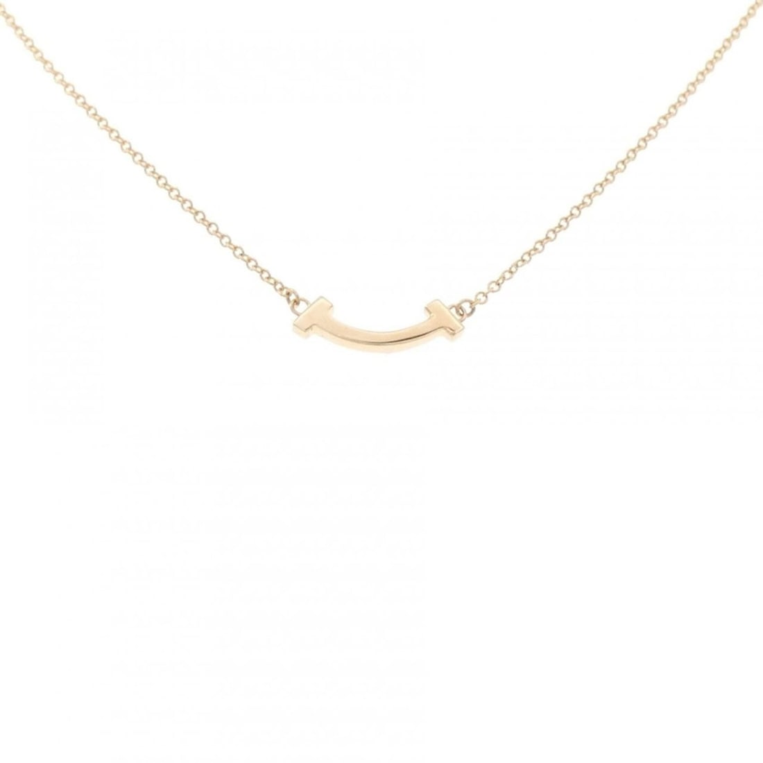Tiffany T Smile Mini Necklace: --- Catalog ---Category: SizePendant Size: 3.5mm x 13.6mm / 0.13'' x 0.53''Neck Circumference: 41 cm - 45 cm / 16.14'' - 17.71''Category: DesignGender: WomenMaterial: Pink gold (18K)Pendant Type: