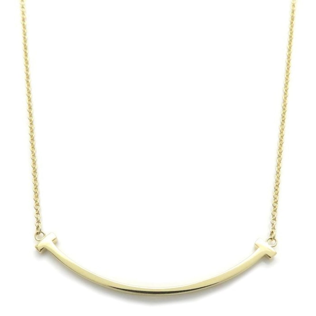 TIFFANY&Co. Tiffany T Smile Small Necklace 18K Yellow Gold Women's 295865: --- Catalog ---Category: SizePendant Size: 3.6mm x 37mm / 0.14'' x 1.45''Neck Circumference: 45.5 cm / 17.91''Category: DesignColor: Yellow goldGender: WomenMaterial: Yellow gold (18K)Necklace Type: