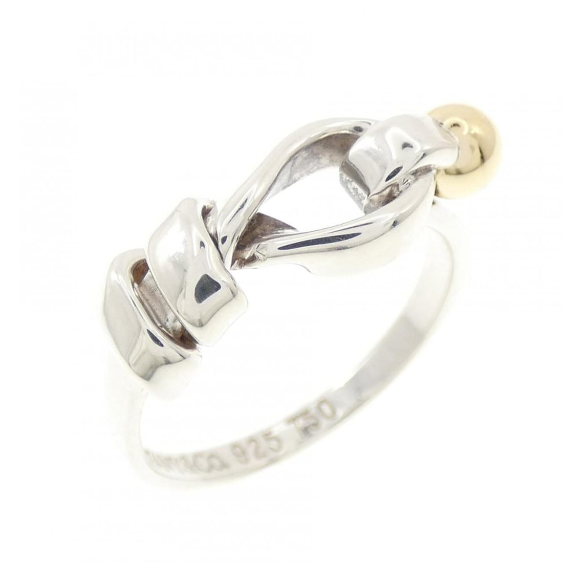 Tiffany & Co. Flat Wire Love Knot Ring: --- Catalog ---Category: SizeJP Size: 8US Size: 4.5Category: DesignType: Band ringColor: Silver, Yellow goldGender: WomenMaterial: Silver 925, Yellow gold (18K)Category: GeneralBrand: Tiffany--- Item