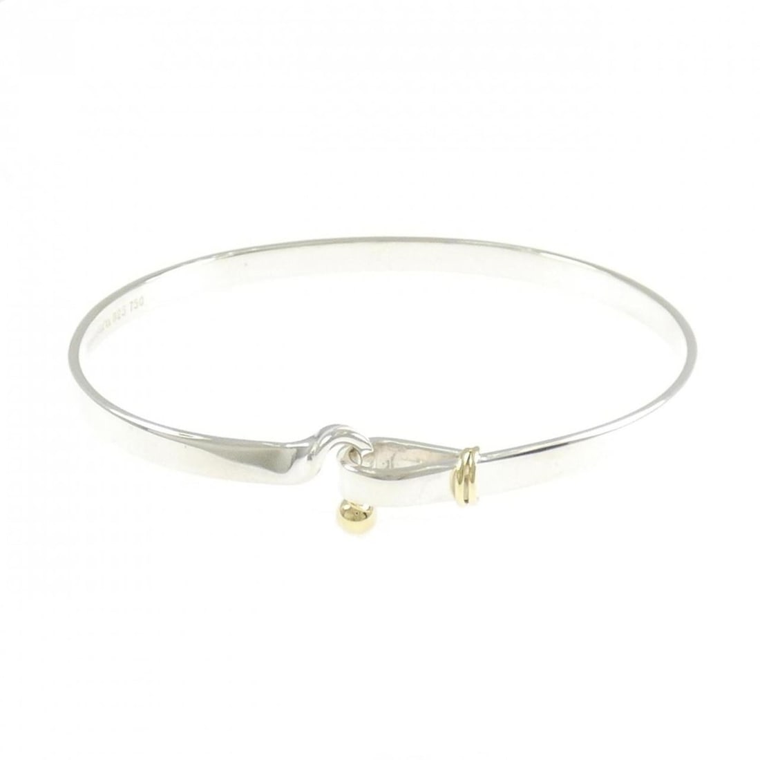 Tiffany Hook & Eye Bangle: --- Catalog ---Category: SizeLength: 18cm / 7.08''Category: DesignType: BangleColor: Silver, Yellow goldGender: WomenMaterial: Silver 925, Yellow gold (18K)Category: GeneralBrand: Tiffany--- Item
