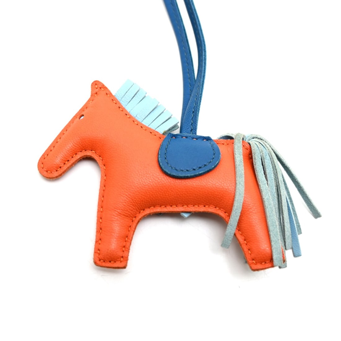 Hermes Rodeo Charm PM (No Engraving) - Women's/Men's Strap Agneau Milo Orange: --- Catalog ---Category: SizeSize (HxWxD): 75.00mm x 90.00mm x 20.00mm / 2.95'' x 3.54'' x 0.79''Category: DesignType: Handbag charmColor: Blue, OrangeGender: WomenMaterial: Agneau MiloCategory: Gener