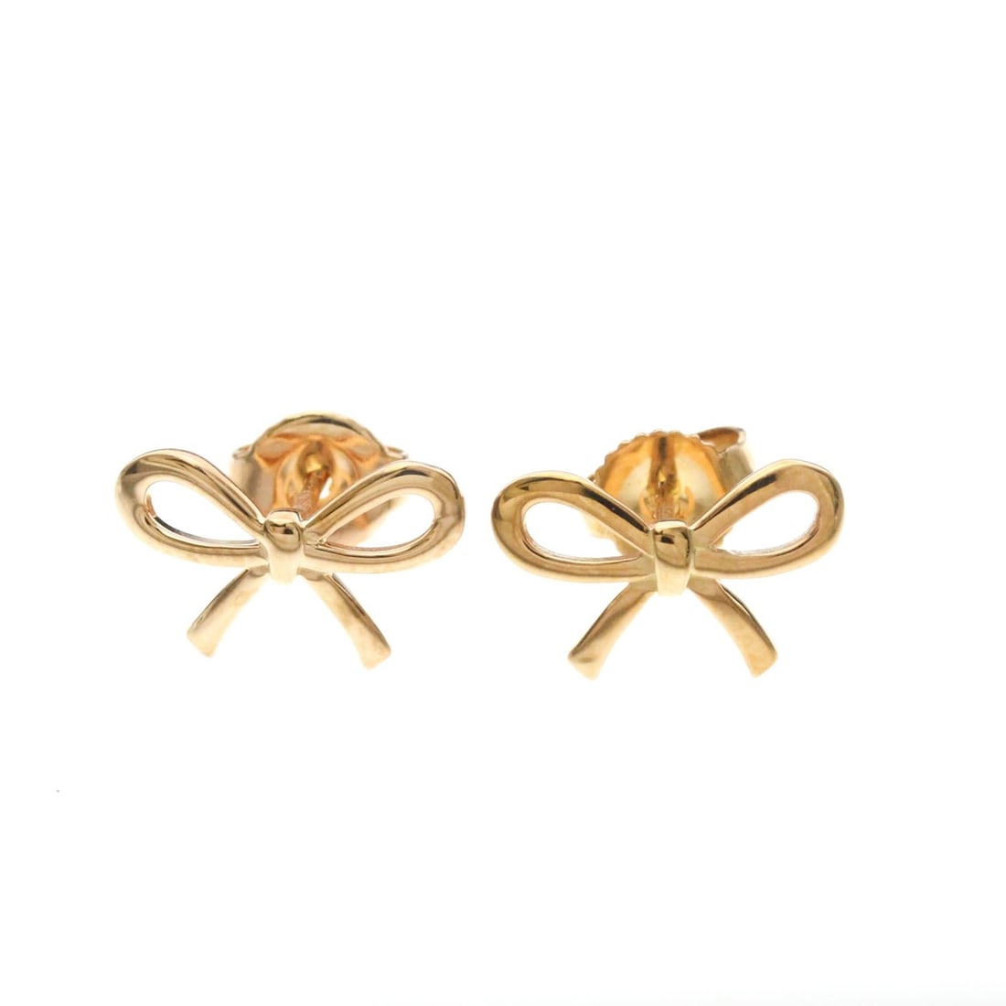 Tiffany Bow Earrings No Stone Pink Gold (18K) Stud Earrings Pink Gold: --- Catalog ---Category: SizeWeight: 2.1g / 0.07oz.Size (HxWxD): 8.50mm x 13.50mm / 0.33'' x 0.53''Category: DesignType: Stud earringsColor: Pink goldMetal: GoldStone: No StoneStyle: FashionGender: Wo