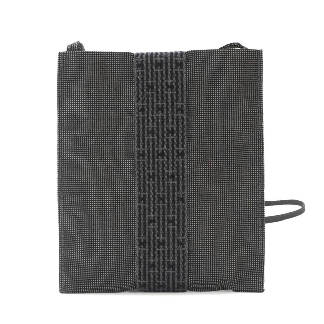 Hermes Herline Pochette Shoulder Handbag, Canvas, Gray: --- Catalog ---Category: SizeWeight: 95g / 3.35oz.Size (HxWxD): 19.5cm x 16.5cm x 1cm / 7.67'' x 6.49'' x 0.39''Strap Length: 119cm / 46.85''Category: DesignType: Handbag, Pochette, Shoulder bagColor: