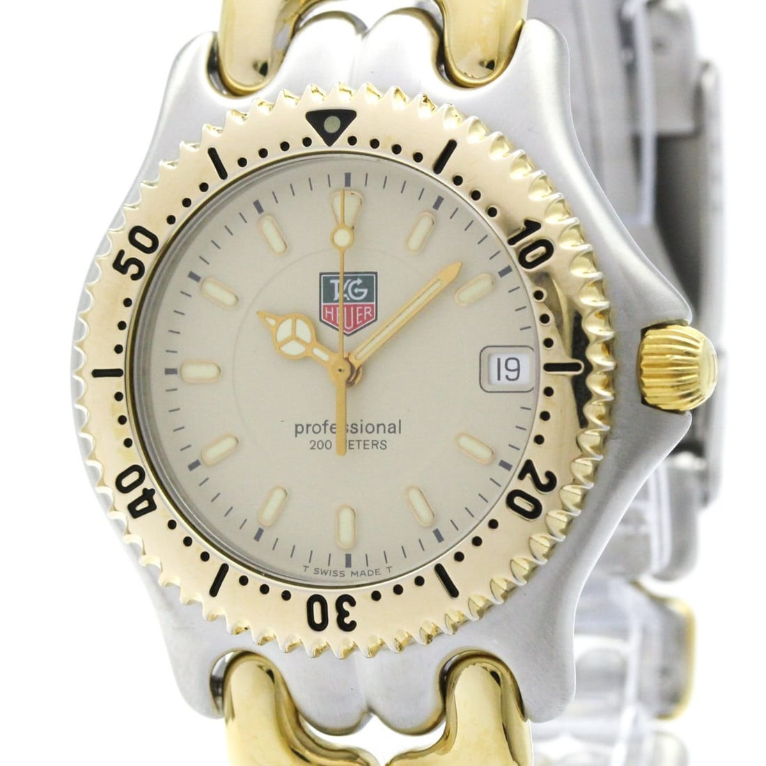 TAG HEUER Sel Professional Gold Plated Steel Mid Size Watch WG1121 Polished: --- Catalog ---Category: SizeCase Diameter: 38mm / 1.5''Category: DesignType: WristwatchStyle: SportGender: MenColor (Dial): IvoryMaterial (Band): Gold plated, Stainless steelMaterial (Case): Gold pla