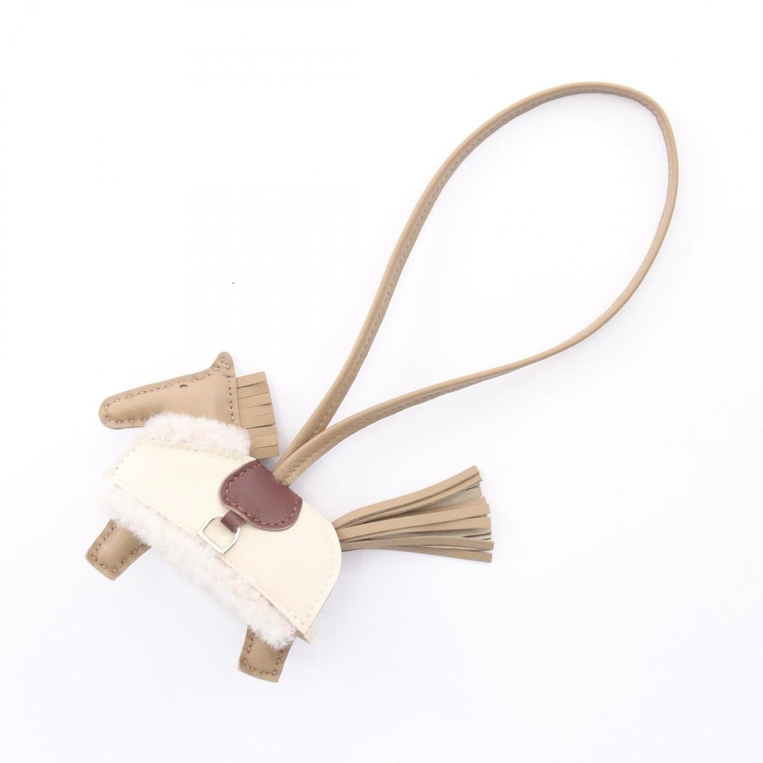Hermes Rodeo PM Robeoplash Beige Malfa Craie Terre Ecru Charm Accessory Wool Agneau Milo Veau Swift: --- Catalog ---Category: DesignType: Handbag charmColor: Beige, Brown, Ecru, IvoryGender: WomenMaterial: Agneau MiloCategory: GeneralBrand: Hermes--- Item List ---Section: ConditionRanking: Rank NS Ne