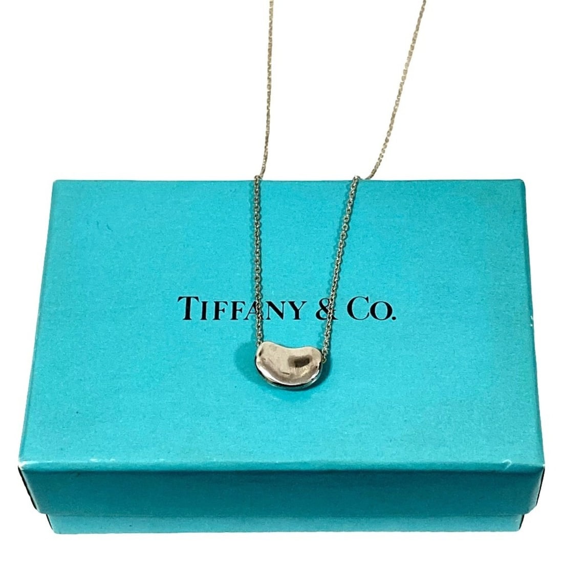 Tiffany & Co. Elsa Peretti Beans Necklace, 925 Sterling Silver, Women's: --- Catalog ---Category: SizePendant Size: 7mm x 10mm / 0.27'' x 0.39''Neck Circumference: 43.5 cm / 17.12''Category: DesignColor: SilverGender: WomenMaterial: Silver 925Necklace Type: NecklaceCategor