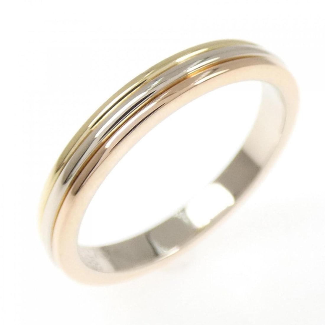 Cartier Three Gold Wedding Ring: --- Catalog ---Category: SizeJP Size: 14US Size: 7Category: DesignType: Band ringGender: WomenMaterial: Pink gold (18K), White gold (18K), Yellow gold (18K)Category: GeneralBrand: Cartier--- Item