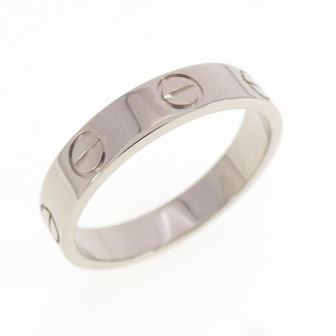 Cartier Mini Love Ring: --- Catalog ---Category: SizeUS Size: 5.5Brand Size: 50Category: DesignType: Band ringGender: WomenMaterial: White gold (18K)Category: GeneralMPN: B4085100Brand: Cartier--- Item List ---Section: