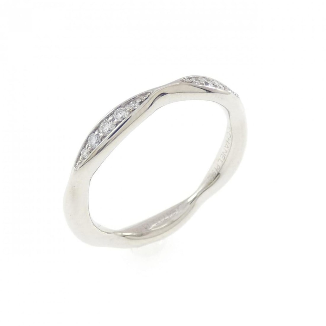 Chanel Camellia Half Eternity Ring: --- Catalog ---Category: SizeUS Size: 3.5Brand Size: 45Category: DesignType: Band ringColor: PlatinumStone: DiamondGender: WomenMaterial: Platinum 950Category: GeneralMPN: J10835Brand: Chanel--- Item