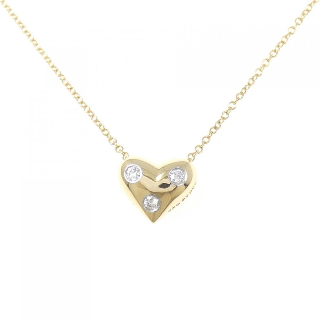 Tiffany Dots Pinched Heart Necklace: --- Catalog ---Category: SizePendant Size: 8.4mm x 9.9mm / 0.33'' x 0.38''Neck Circumference: 41 cm / 16.14''Category: DesignGender: WomenMaterial: Platinum 950, Yellow gold (18K)Pendant Type: