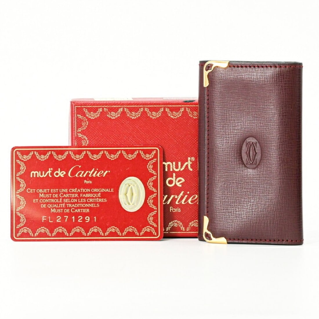 Cartier Must Line Key Case, 6-ring, Bordeaux Leather, Women's, L3000127: --- Catalog ---Category: DesignType: KeycaseColor: BordeauxGender: WomenMaterial: Leather Category: GeneralLine: MustBrand: CartierCategory: Physical PropertiesSize (HxWxD): 6cm x 10cm x 1.5cm / 2.36'