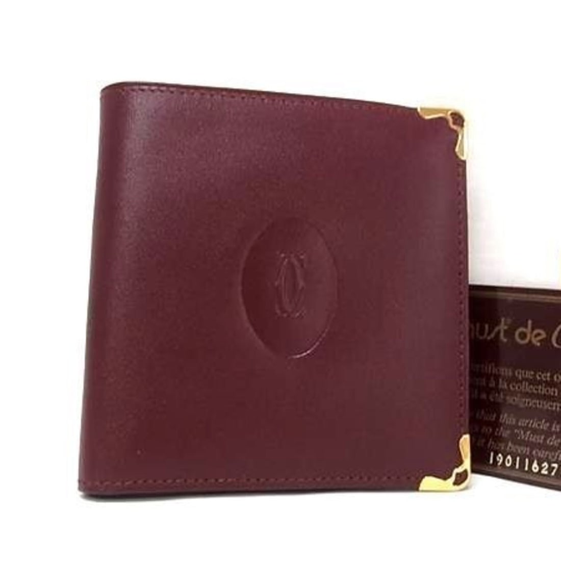 Cartier Bi-fold Wallet, Must Line, 73184192, Bordeaux Calf Leather, Men's/Women's: --- Catalog ---Category: SizeSize (HxWxD): 10.3cm x 10cm x 1.8cm / 4.05'' x 3.93'' x 0.7''Category: DesignType: Wallet (bi-fold)Color: BordeauxGender: Men,WomenCategory: GeneralMPN: 73184192Brand: Car