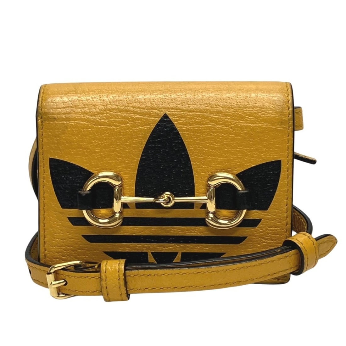 Gucci bi-fold wallet, horsebit design, Adidas collaboration, leather, 702248: --- Catalog ---Category: SizeSize (HxWxD): 9cm x 11cm x 3cm / 3.54'' x 4.33'' x 1.18''Category: DesignType: Wallet (bi-fold)Color: YellowGender: WomenMaterial: Leather Category: GeneralBrand: Gucci---