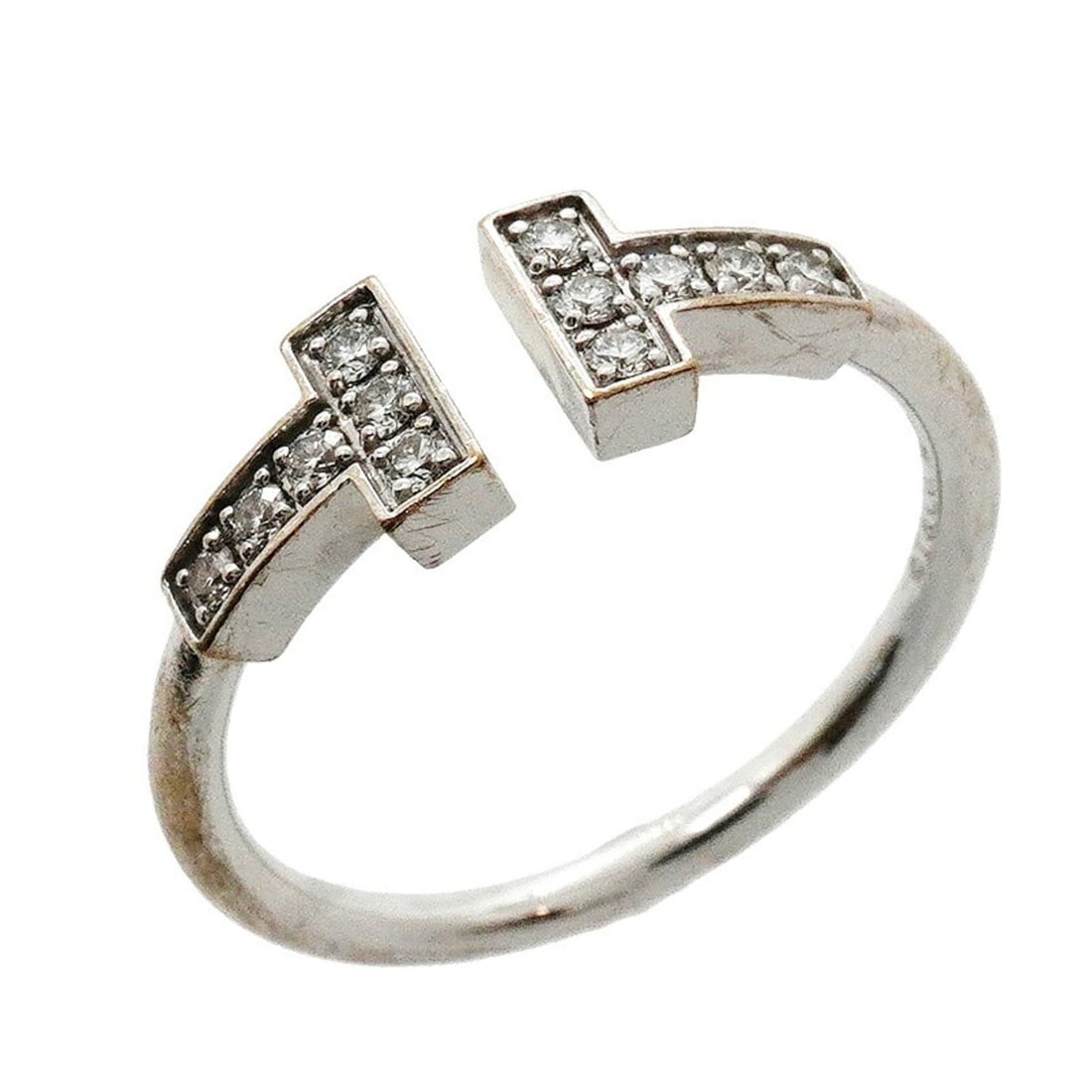 Tiffany & Co. T Wire Ring, 18K White Gold, Diamond, Size 11.5 (Women's): --- Catalog ---Category: SizeJP Size: 11.5US Size: 6Category: DesignType: Band ringStone: DiamondGender: WomenMaterial: White gold (18K)Category: GeneralBrand: Tiffany--- Item List ---Section: Conditi