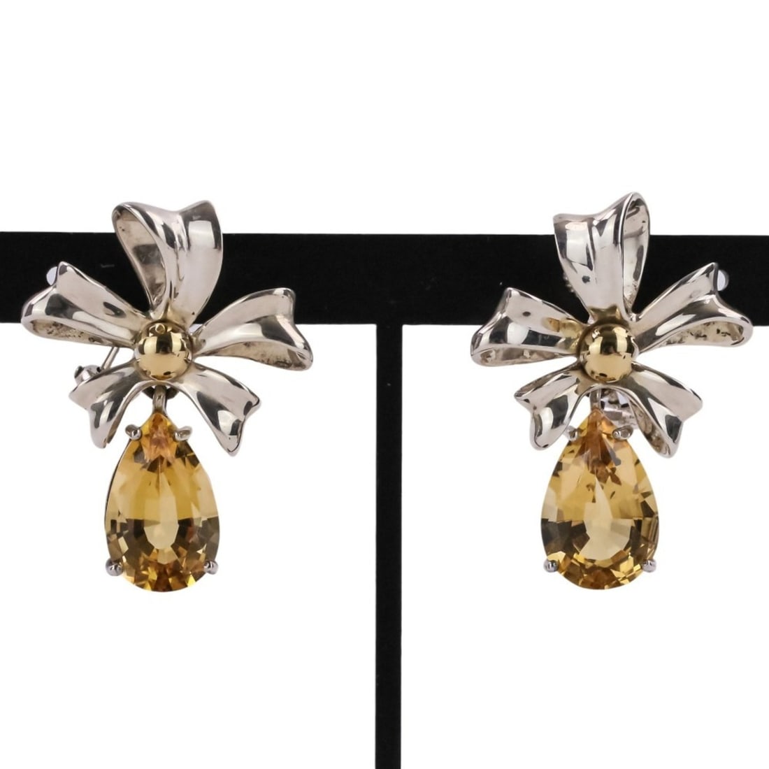 Tiffany & Co. 1990 Vintage Flower Ribbon Motif Citrine Earrings, 925 Sterling Silver, Women's: --- Catalog ---Category: SizeSize (HxWxD): 3.00mm x 2.20mm / 0.12'' x 0.09''Category: DesignType: Clip earringsColor: SilverGender: WomenMaterial: Gold (18K), Silver 925Category: GeneralBrand: Tiffany