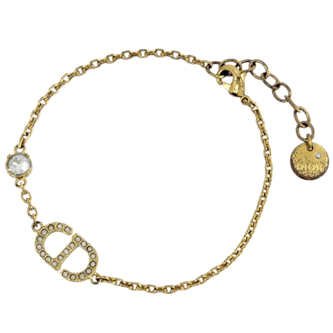 Christian Dior bracelet, gold with rhinestones, for women.: --- Catalog ---Category: SizeLength: 15.5cm - 18cm / 6.1'' - 7.08''Category: DesignType: Charm braceletColor: GoldGender: WomenMaterial: Gold plating, RhinestoneCategory: GeneralBrand: Christian Dior-