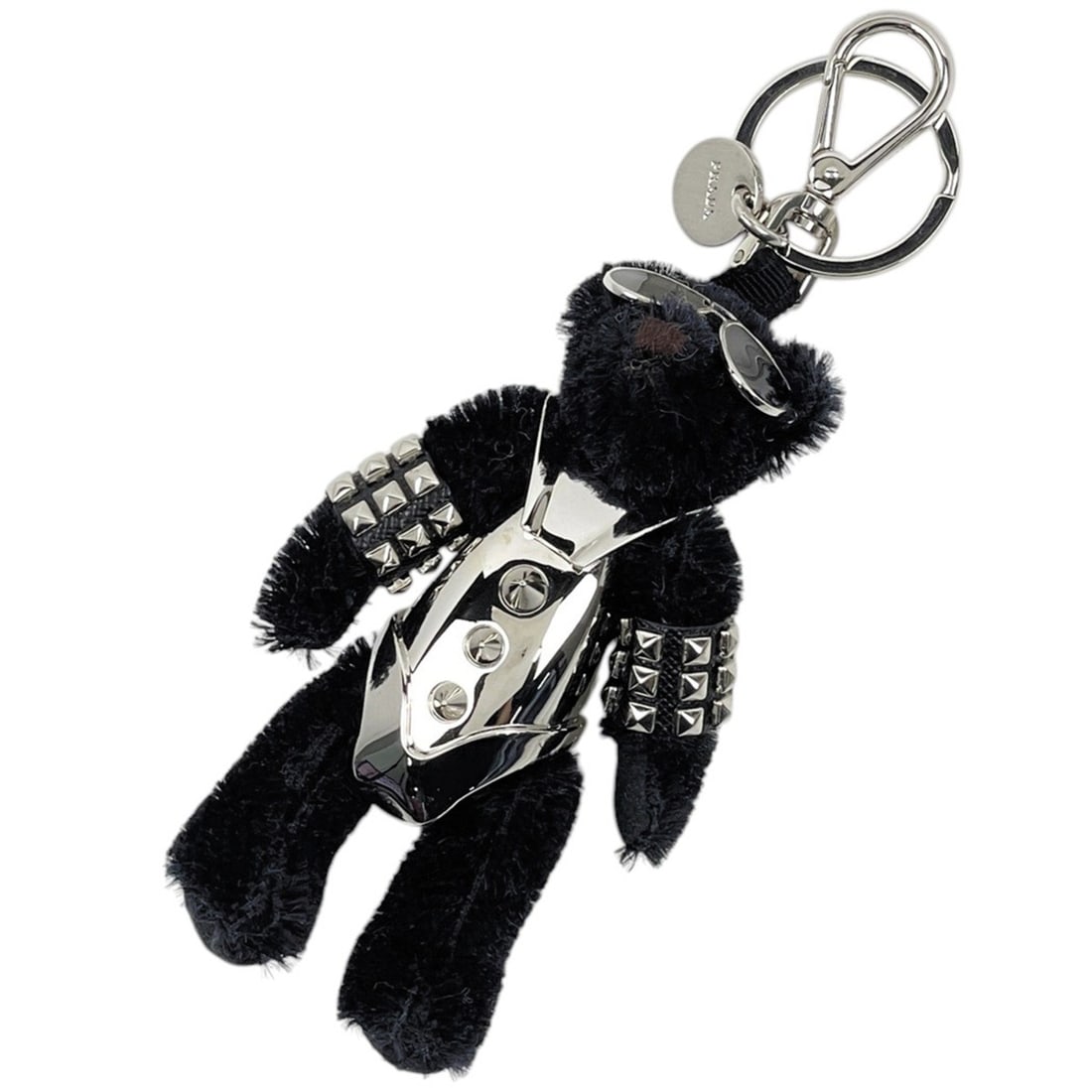 Prada bag charm, Bear Trick keychain, metal fabric, black and silver, for women.: --- Catalog ---Category: SizeSize (HxWxD): 12.5cm x 7cm / 4.92'' x 2.75''Category: DesignType: KeyringColor: Black, SilverGender: WomenMaterial: MetalCategory: GeneralBrand: Prada--- Item List ---Sect