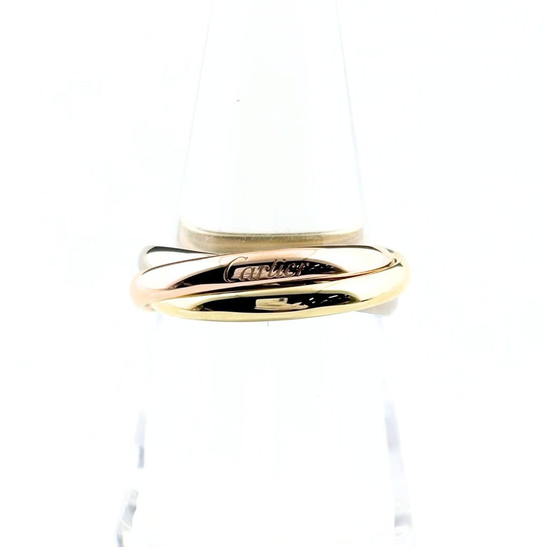 Cartier Trinity ring in yellow gold (YG), pink (PG), and white (WG). Three-color design. 750 gold.: --- Catalog ---Category: SizeUS Size: 6.5Brand Size: 53Category: DesignType: Band ringGender: WomenMaterial: Pink gold (18K), White gold (18K), Yellow gold (18K)Category: GeneralBrand: Cartier--- Item