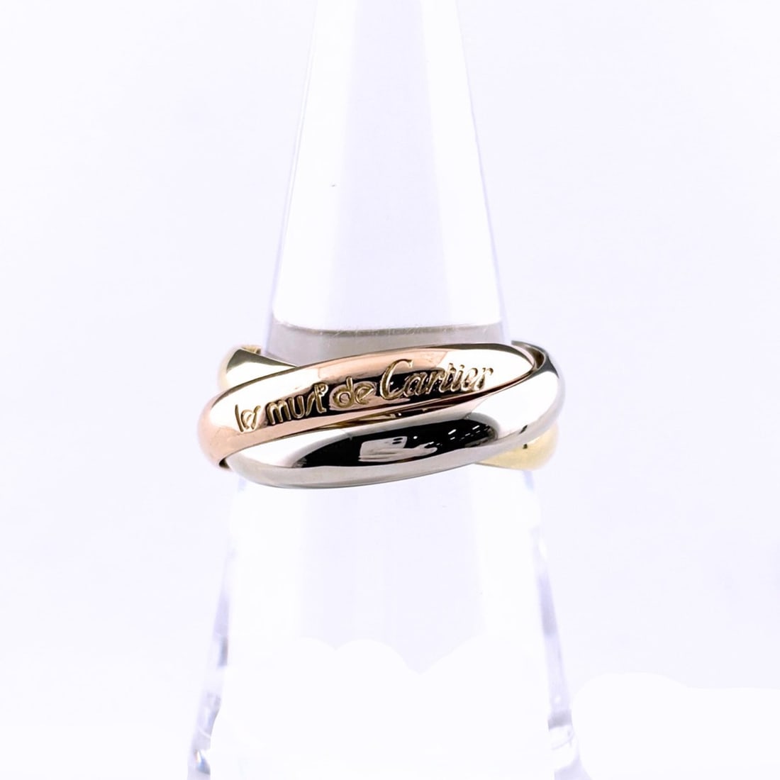 Cartier Trinity ring in yellow gold (YG), pink (PG), and white (WG). Three-color design. 750 gold.: --- Catalog ---Category: SizeUS Size: 7Brand Size: 54Category: DesignType: Band ringGender: WomenMaterial: Pink gold (18K), White gold (18K), Yellow gold (18K)Category: GeneralBrand: Cartier--- Item L