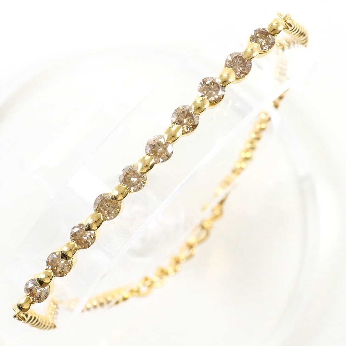 18K (18-karat) Yellow Gold Bracelet with Brown Diamonds (1.064ct), Certificate of Authenticity,: --- Catalog ---Category: SizeLength: 19cm / 7.48''Weight: 4.7g / 0.16oz.Category: DesignType: Charm braceletColor: Brown, Yellow goldMetal: GoldStone: DiamondGender: WomenMaterial: Yellow gold (18K)Me