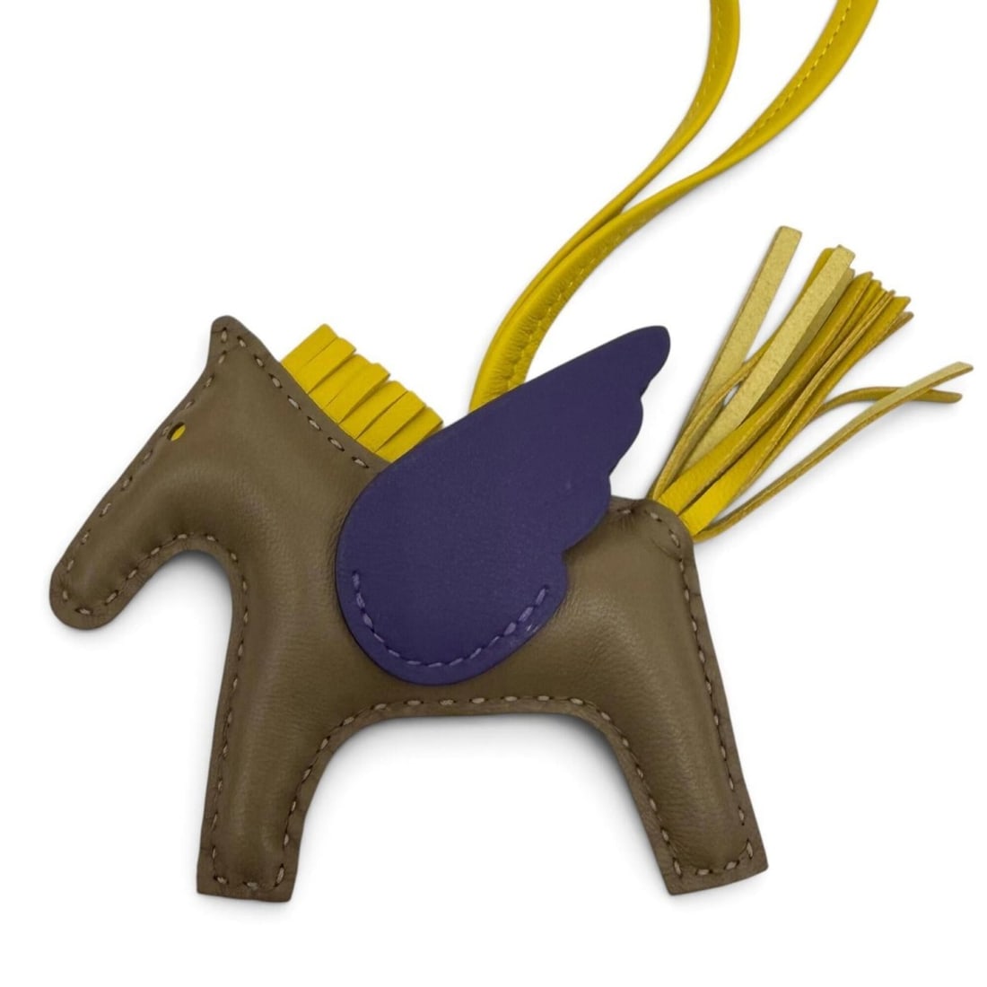 HERMES Rodeo Charm Pegasus PM Agneau Milo Swift Etoupe Jaune Naple Purple Bag G Stamp Made in France: --- Catalog ---Category: SizeSize (HxWxD): 73.00mm x 130.00mm / 2.87'' x 5.12''Category: DesignType: Handbag charmColor: Etoupe gray, PurpleGender: WomenMaterial: Agneau Milo, Swift leatherCategory: G