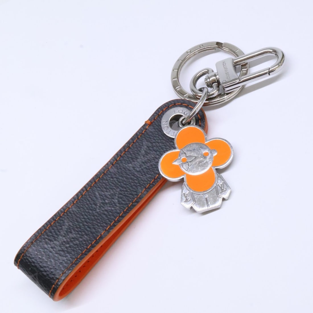 LOUIS VUITTON Louis Vuitton Dragonne Vivienne Keychain Orange Men's: --- Catalog ---Category: DesignType: KeyringColor: LV OrangeGender: MenMaterial: Monogram EclipseCategory: GeneralBrand: Louis Vuitton--- Item List ---Section: ConditionRanking: Rank AB Used - Traces 