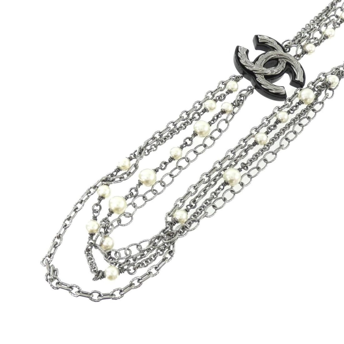 Chanel necklace: --- Catalog ---Category: SizePendant Size: 27mm x 40mm / 1.06'' x 1.57''Neck Circumference: 43.5 cm - 53 cm / 17.12'' - 20.86''Category: DesignColor: Black, WhiteGender: WomenNecklace Type: