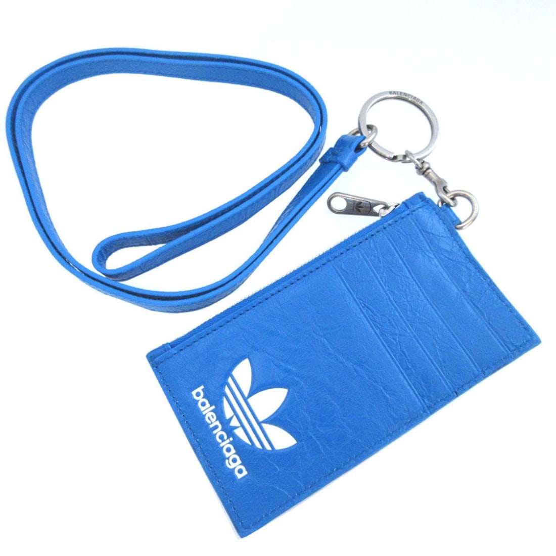 Balenciaga & Adidas Collaboration 721894 Leather Blue with Strap Business Card Holder/Card Case: --- Catalog ---Category: DesignType: Card caseColor: BlueGender: WomenMaterial: Leather Category: GeneralMPN: 721894Brand: BalenciagaCountry of Origin: ItalyCategory: Physical PropertiesSize (HxWxD): 