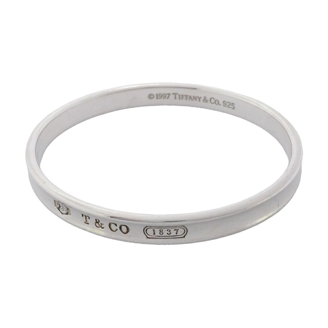 Tiffany & Co. Narrow Sterling Silver Bangle for Women: --- Catalog ---Category: SizeLength: 18cm / 7.08''Category: DesignType: BangleGender: WomenMaterial: Silver 925Category: GeneralBrand: Tiffany--- Item List ---Section: ConditionRanking: Rank AB Used -