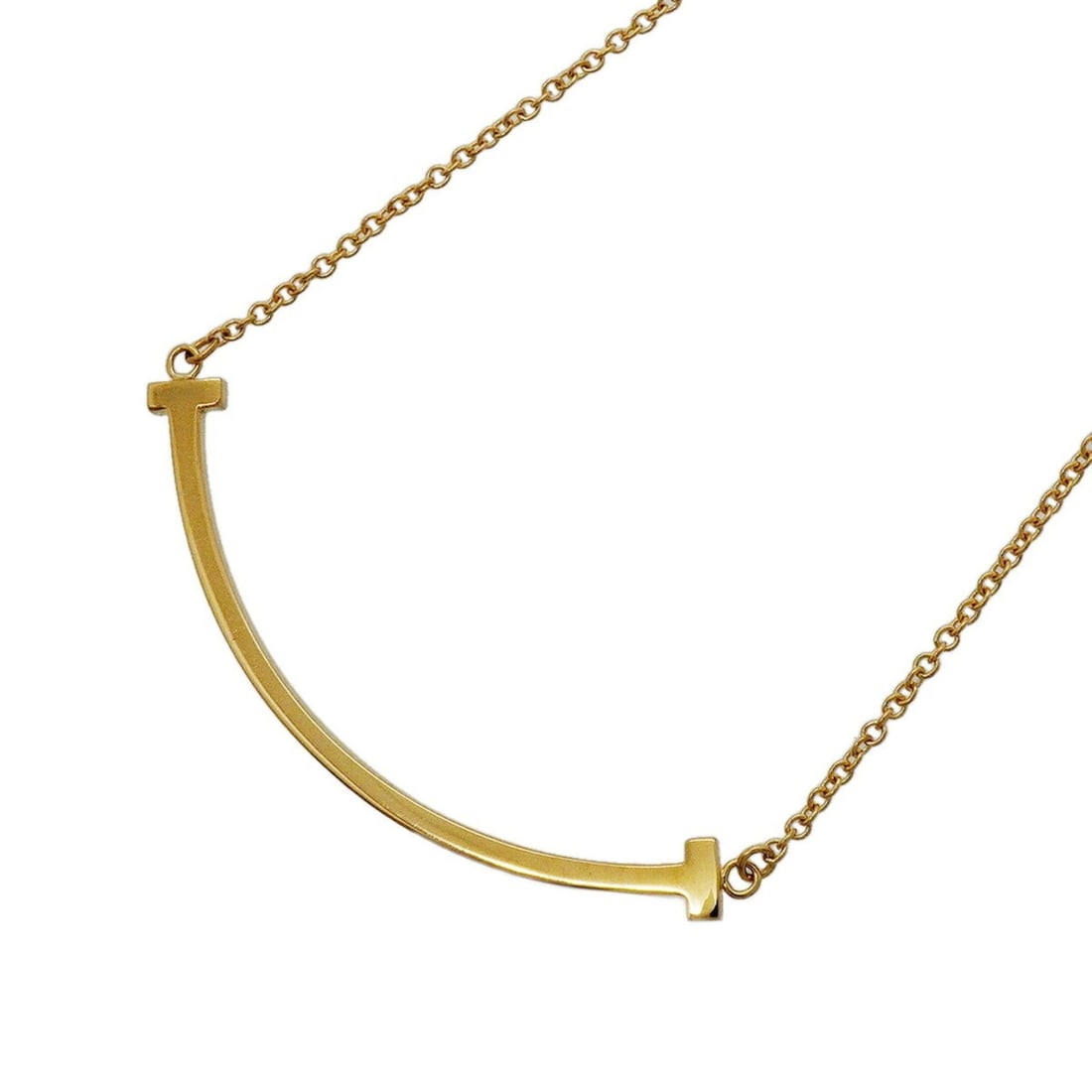 Tiffany & Co. T Smile Small Necklace, 18K Yellow Gold, Women's: --- Catalog ---Category: SizePendant Size: 10mm x 37mm / 0.39'' x 1.45''Neck Circumference: 40.5 cm - 45.5 cm / 15.94'' - 17.91''Category: DesignGender: WomenMaterial: Yellow gold (18K)Necklace Type: 