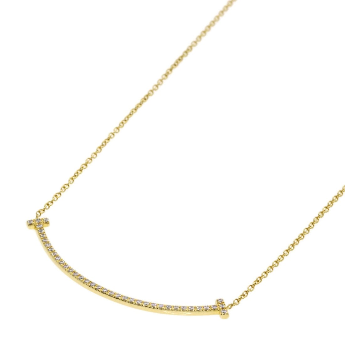 Tiffany & Co. T Smile Small Diamond Necklace, 18K Yellow Gold, Women's.: --- Catalog ---Category: SizePendant Size: 3.6mm x 37mm / 0.14'' x 1.45''Neck Circumference: 41 cm / 16.14''Category: DesignStone: DiamondGender: WomenMaterial: Yellow gold (18K)Necklace Type: Necklac